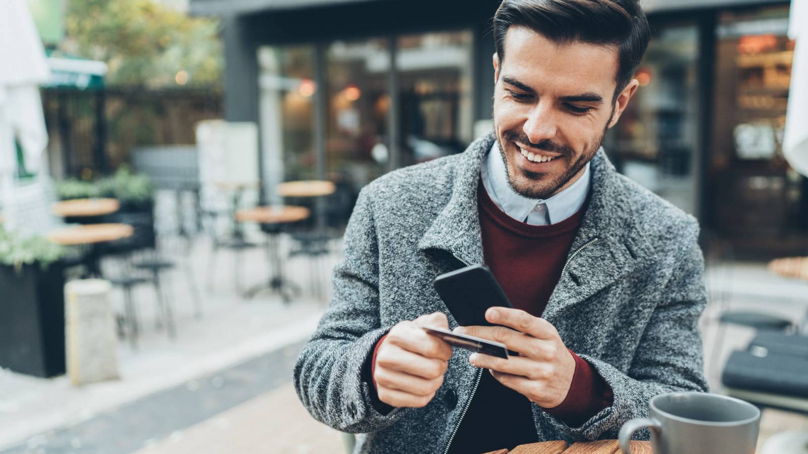 man looking at card